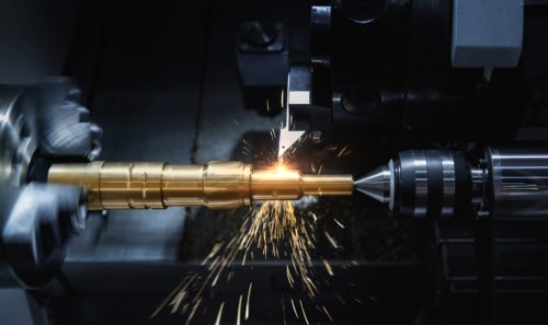 Close up of cnc turning machine with sparks